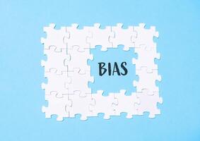 Jigsaw puzzle with the word Bias written in the middle photo