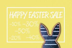 Sign for a happy Easter sale with a rabbit on it photo