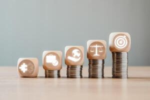 Wooden blocks on stacked coins representing business ethics, integrity, and corporate responsibility in a modern business environment. photo