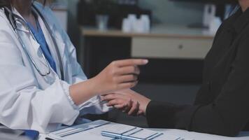 A doctor is talking to a patient video