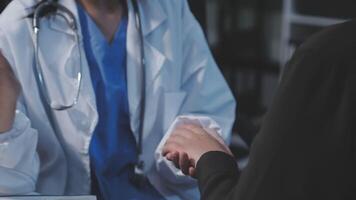 A doctor shaking hands with a patient video