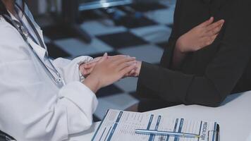 A doctor shaking hands with a patient video