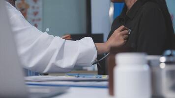 A doctor is examining a woman's chest video