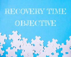 Jigsaw puzzle with the words Recovery Time Objective written above it photo