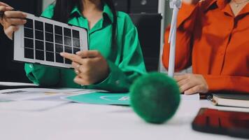 Two people are working on a tablet computer video