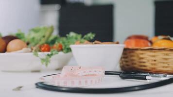 A stethoscope and a basket of fruit and vegetables video