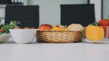 A table with a basket of vegetables and a cup of coffee video