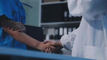 A doctor shaking hands with a patient video