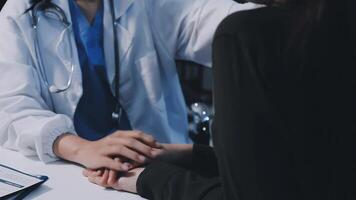 A doctor is holding the hand of a patient video