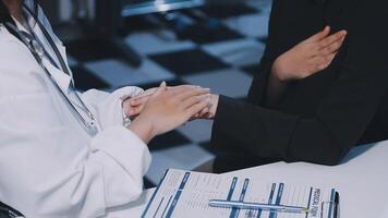 A doctor shaking hands with a patient video