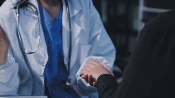 A doctor shaking hands with a patient video