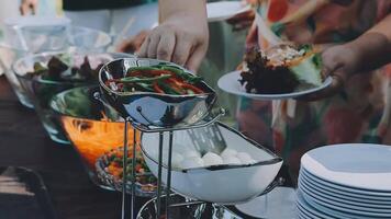A buffet table with plates of food and silverware video