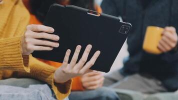 A person holding a tablet computer in front of them video