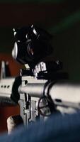 Vertical Shooting gallery client hitting paper targets with ammo, extreme close up of rifle. Close up of person at firing range establishment shooting bullseyes, enjoying using semiautomatic weapon, camera A video