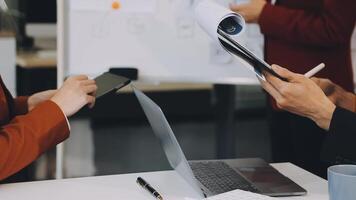 Business people working on a project at a table video