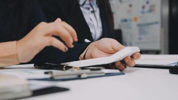 Two business people are working on a document video