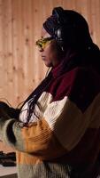 Vertical Portrait of joyous shooting range customer shooting targets with pistol, learning to operate handgun in close quarters. Smiling woman at shooting ground facility firing lethal fire weapon, camera A video