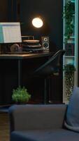 Vertical Contemporary studio with modern decorations and neon lights creating a cozy casual living space with a smart tv and comfortable setup. Empty apartment loft with trendy furniture. video