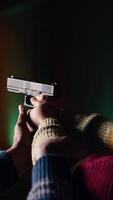 Vertical Shooting gallery worker teaching student how to hold pistol, close up. Firing range specialist providing guide to woman learning how to achieve high level of proficiency with firearms, camera B video