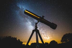 Milky way galaxy with telescope on tripod photo