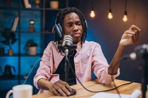 Radio host speaking into microphone, recording podcast within sleek home studio, generating professional audio broadcast photo