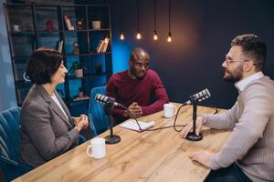 Podcasters engaging in lively discussions during a recording session in a studio filled with microphones and advanced audio equipment photo