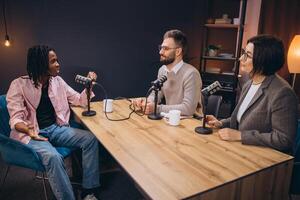 Professional radio team interviewing guest, utilizing modern studio microphones and broadcasting technology photo