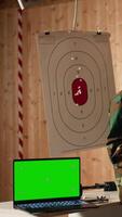 Vertical Mockup laptop next to soldiers in shooting range training discussing about weapons. Isolated screen notebook in firing range next to military units having conversation, camera A video