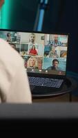Vertical Smiling black man hosting a virtual family meeting online via conference, meeting with the relatives and sharing latest news. Person uses web connection to chat with loved ones. Camera A. video