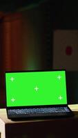 Vertical Green screen laptop in shooting range next to man successfully shooting targets. Mockup notebook next to person being congratulated by instructor for accurately hitting bullseye, camera B video