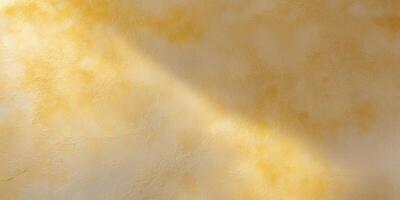 Textured golden yellow surface with subtle light variations perfect for backgrounds and design. photo