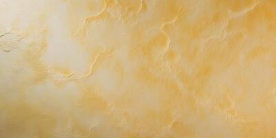 Textured golden yellow surface with subtle light variations perfect for backgrounds and design photo
