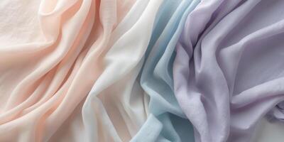 Soft flowing fabric in pastel colors creating an elegant background for creative projects and designs. photo
