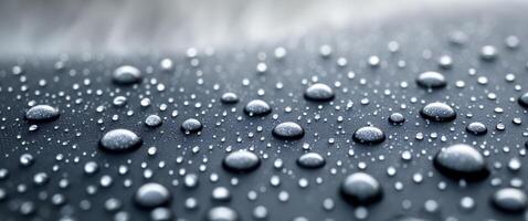 Close up picture of waterproof fabric with water droplets on the fabric photo