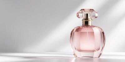 Elegant Perfume Bottle with Soft Pink Hue. photo