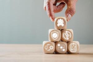 Wooden cubes with icons symbolizing standard operating procedures, teamwork, and efficiency in business processes. photo
