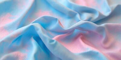 Crumpled blue and pink textured background with a gradient effect offers depth and visual intrigue for creative designs and compositions photo