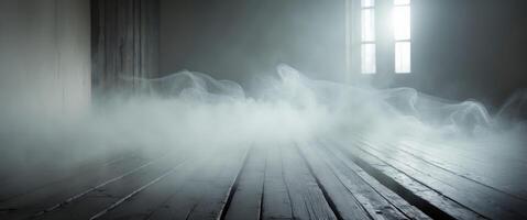 Mist drifts across a wooden floor creating a mysterious atmosphere in a dimly lit space photo