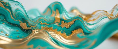 Mesmerizing fluid art with swirling turquoise and gold creating an abstract liquid plasma effect. photo