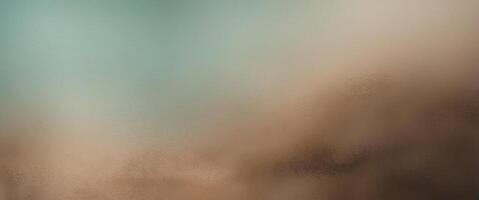 Subtle teal to light brown gradient creating a visually textured background photo