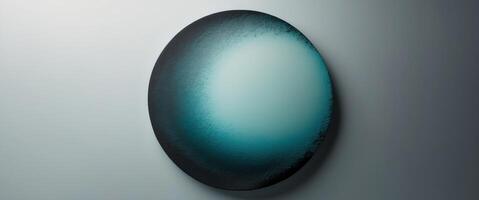 Round gradient with a rough texture going from blue green to charcoal on a see through background photo