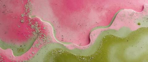 Abstract grunge background design in pink and green with a speckled and textured surface photo