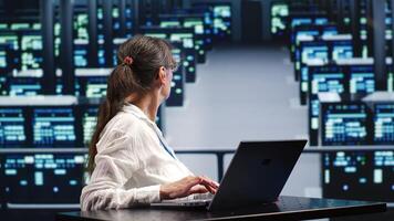 Capable repairman in cloud computing business equipped to handle complex computational operations, doing regular upgrades to supercomputers, increasing processing power to prevent perils photo