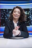 News reporter on midnight talk show going live on television channel broadcast, covering daily events and breaking news in studio. Journalist presenter reporting information on global tv network. photo