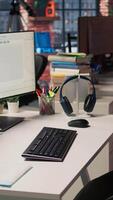 Vertical PC in startup office used to design and implement algorithms enabling machine learning. Technology unicorn venture workspace with PC used to conduct code reviews to fix bugs, jib down shot video