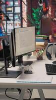 Vertical Empty AI tech agency office providing custom software development services. Technology venture workspace using machine learning to streamline coding process in startup office, jib down shot video