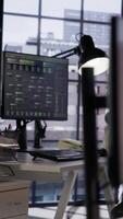 Vertical PC in startup office used to design and implement algorithms enabling machine learning. Technology unicorn venture workspace with PC used to conduct code reviews to fix bugs, close up shot video