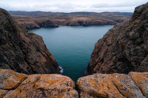 Dramatic cliffs and ocean view from a high vantage point photo