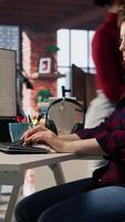 Vertical Startup engineer conducting detailed code review to fix bugs, identifying potential performance and technical issues with company software. IT worker debugging and optimizing code, camera A video