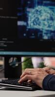 Vertical CTO manager in AI focused startup designing, coding and debugging applications in different software languages. Chief technician officer doing code testing and quality assurance, camera B close up video